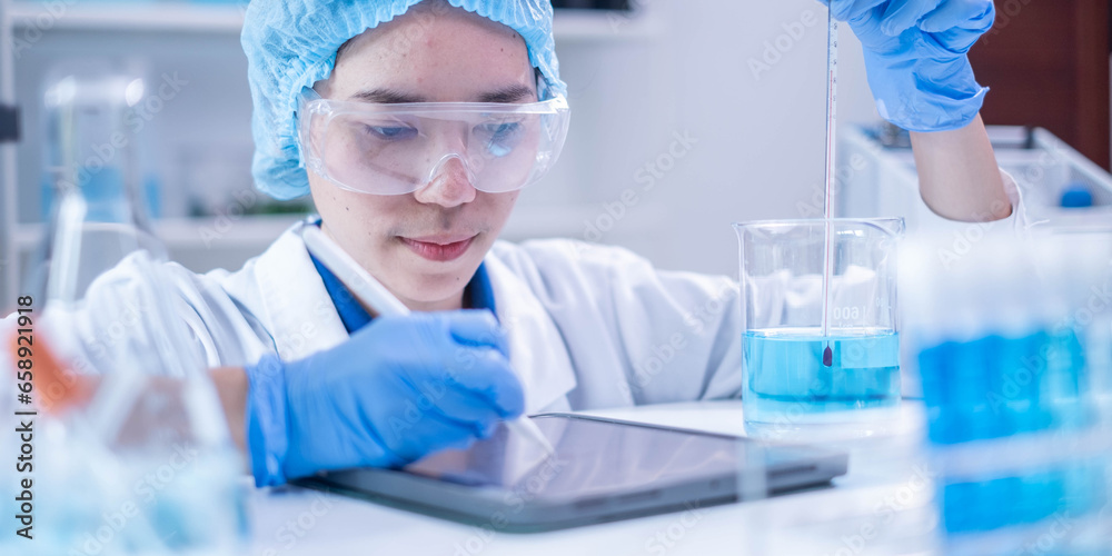 Fototapeta premium Professional woman specialist doctor laboratory white uniform use thermometer temperature on blue liquid in healthcare and medicine experiment equipment with glove care, young adult female scientist