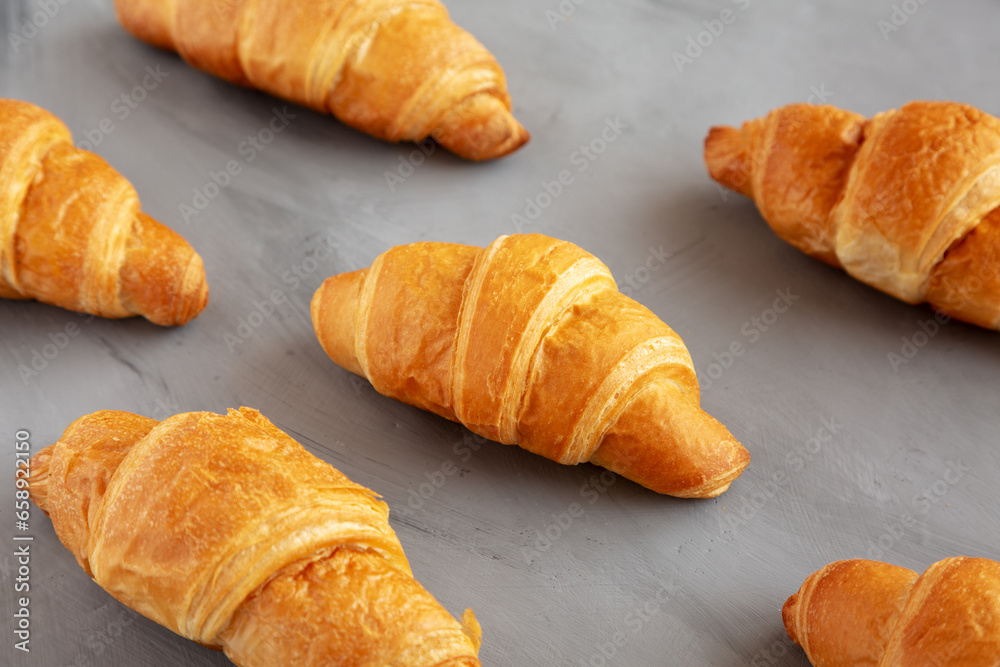 Homemade Croissants on a gray background, side view. Homemade Croissants on a gray background, side view.