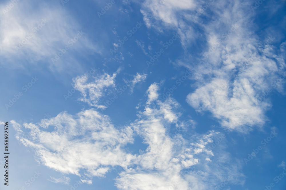Fototapeta premium Blue sky with fluffy clouds; soft white clouds on blue sky. Skyscraper background.