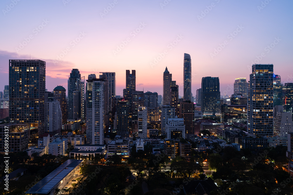 Bangkok city skyline with skyscrapers in evening