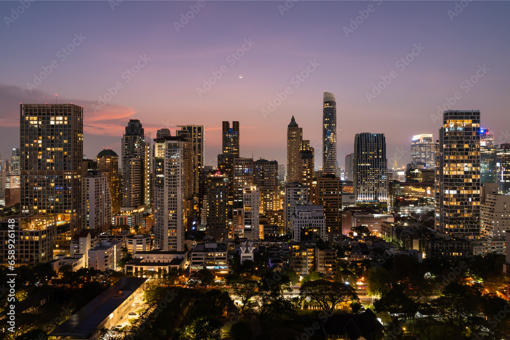 Beautiful panoramic view on night Bangkok skyline, office skyscrapers and lights