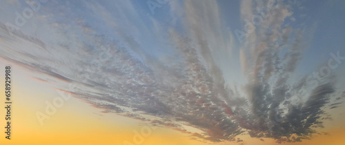 Beautiful summer cloud on colorful dawn sky. Panoramic heaven background
