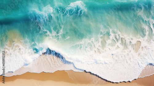 An aerial view captures crashing waves along the shoreline of a tropical beach  offering an abstract perspective of the ocean s dynamic surf