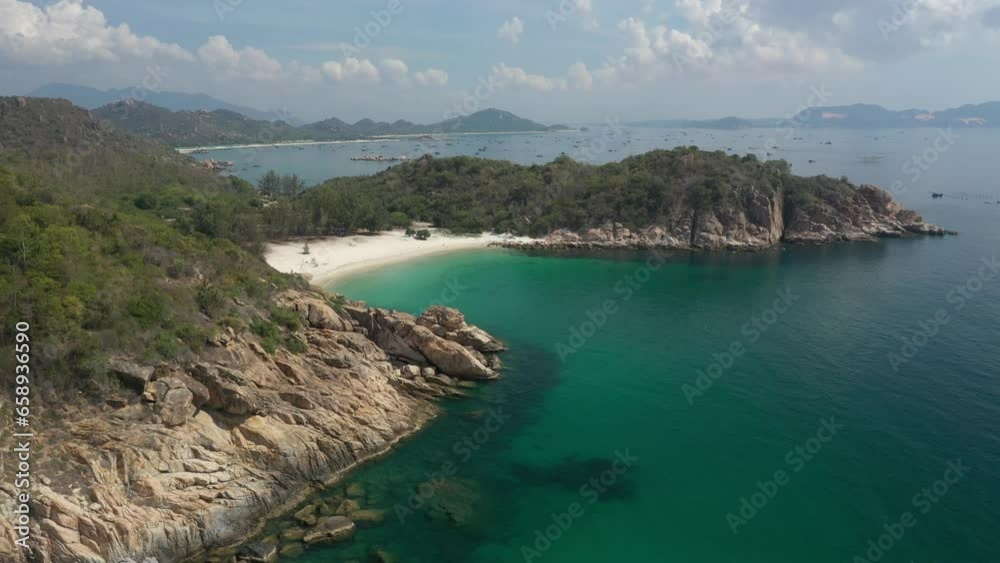 Con beach, aerial view with beautiful lagoon in turquoise colour and white boat, Lobster farm, flying over idyllic beach in Binh Lap, Ninh Thuan, Vietnam Con beach, aerial view with beautiful lagoon in turquoise colour and white boat, Lobster farm, flying over idyllic beach in Binh Lap, Ninh Thuan, Vietnam