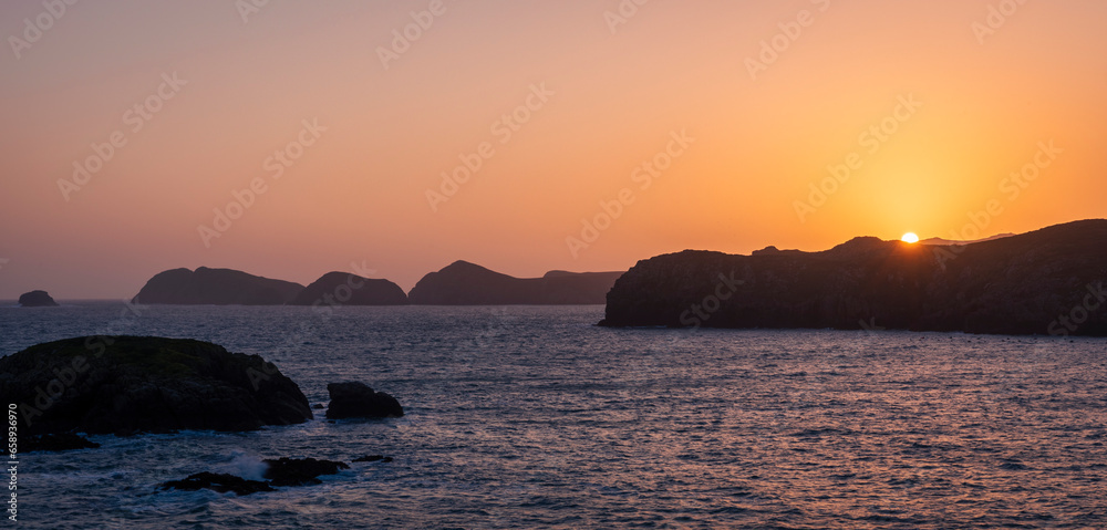 Sunset along the rugged coastline of St Davids in Pembrokeshire south west Wales UK