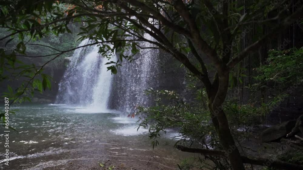 cascada la motilona, beautiful tropical waterfalls in the deep rainforest of the jungle near Paicol in Colombia cascading into a turquoise pool along the riverbed. cascada la motilona, beautiful tropical waterfalls in the deep rainforest of the jungle near Paicol in Colombia cascading into a turquoise pool along the riverbed.