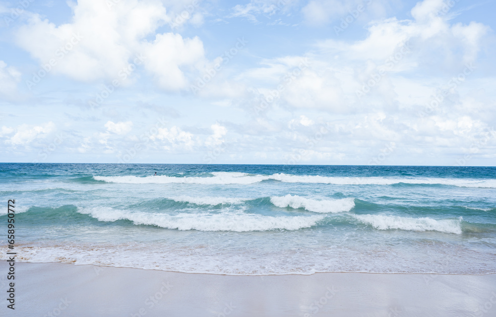 Beautiful tropical sand on beach and blue sky with white clouds, Soft Wave Of Blue Ocean On Sandy Beach, summer vacation and holiday concept.