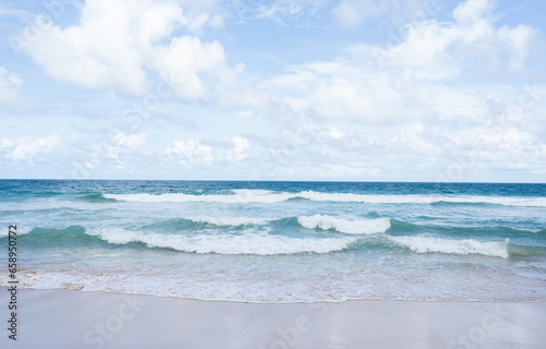Beautiful tropical sand on beach and blue sky with white clouds, Soft Wave Of Blue Ocean On Sandy Beach, summer vacation and holiday concept.