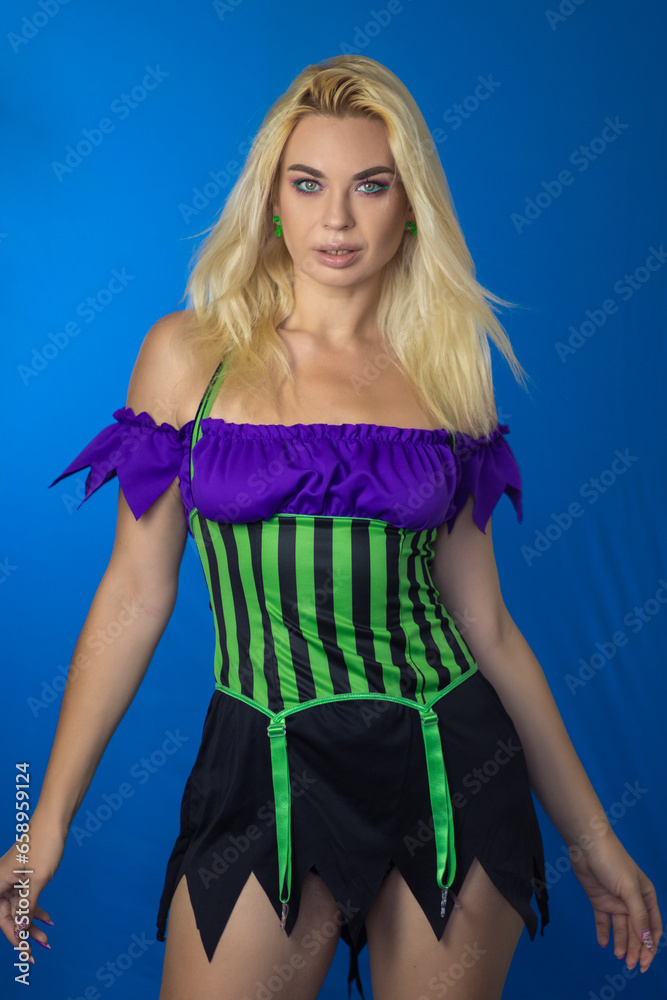 Young beautiful blonde woman in a witch costume Young beautiful blonde woman in a witch costume