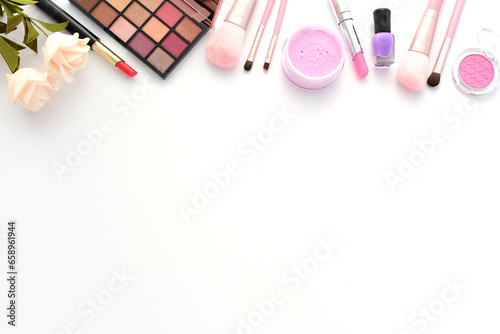 Various cosmetics and makeup tools are left blank on a white background