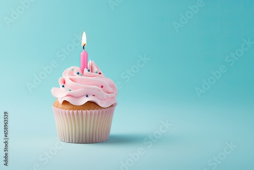 Pink cake with a candle on a blue background