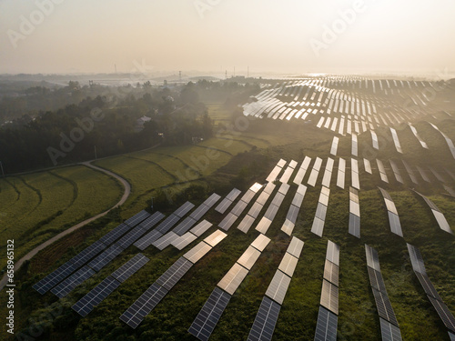 aerial view solar power station on mountain with sunrise