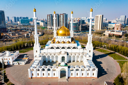 Kazakhstan. Nur Astana Mosque. Nur Astana Meshiti. White mosque with gold domes. Modern architecture of capital of the Republic of Kazakhstan. Summer. City landscape. photo