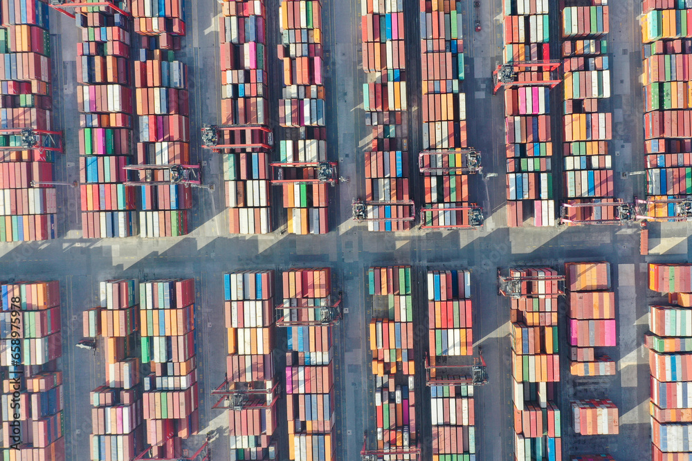 Container ship docked in port as seen from above Container ship docked in port as seen from above