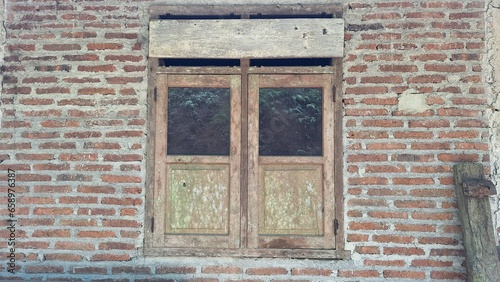 classic window in the middle of a brick wall