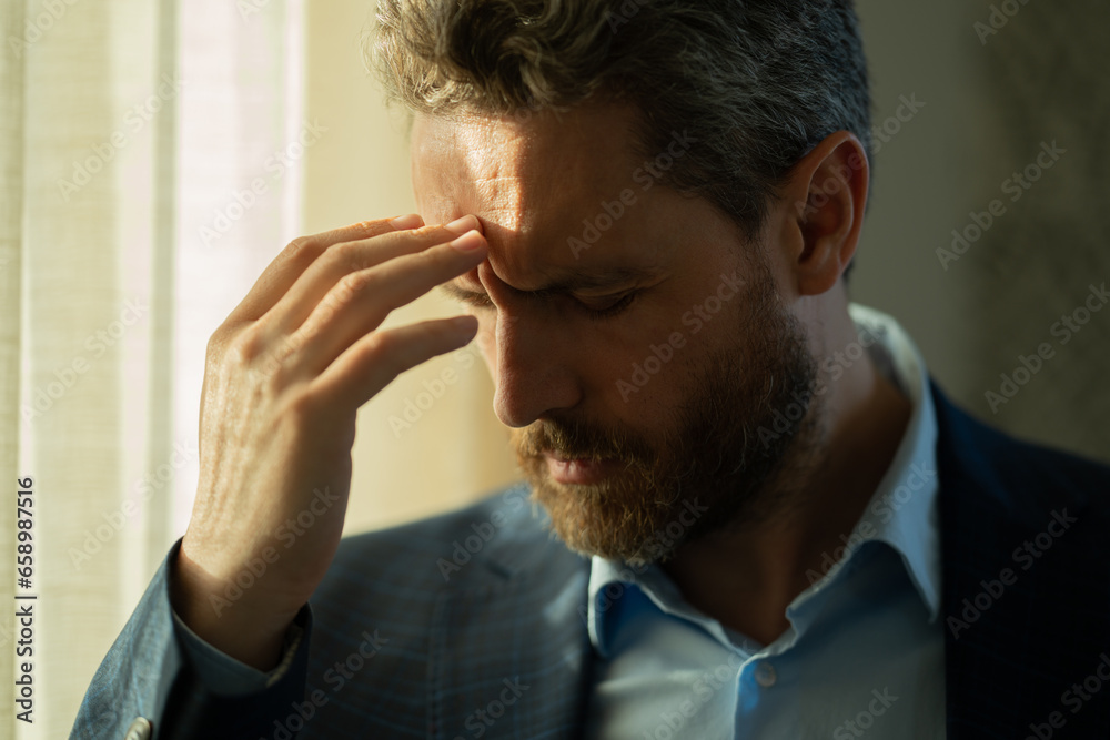 Headache, tiredness and stress. Close up portrait of man in suit got headache migraine. Headache pain concept. Painful men are stressed at work in office. Stressful and headache. Headache, tiredness and stress. Close up portrait of man in suit got headache migraine. Headache pain concept. Painful men are stressed at work in office. Stressful and headache.