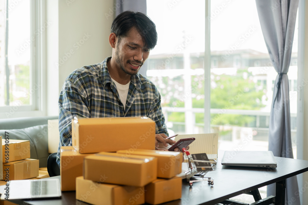 African American male manager who packs parcels in warehouse before sending orders to customers of online store, SME business concept African American male manager who packs parcels in warehouse before sending orders to customers of online store, SME business concept
