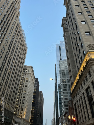 Low angle view of buildings in Chicago against sky at dusk