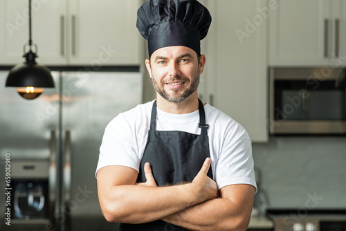Handsome middle age man in chef uniform at kitchen. Cooking and culinary. Restaurant menu concept. Catering and cooking, advertising food concept. Man chef in uniform in kitchen.