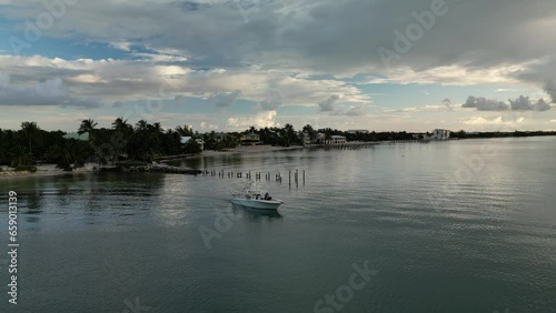 Wallpaper Mural Aerial view of fishermen leaving the dock and headed out to sea at sunrise. Torontodigital.ca