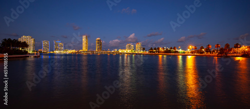 Night panoramic photo of Miami landscape. Bayside Marketplace Miami Downtown behind MacArthur Causeway from Venetian Causeway.