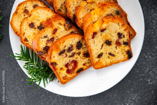fruit cake pastry dried fruits cherries, dried apricots, prunes, raisins sweet Christmas sweet dessert holiday treat new year and christmas meal food snack on the table copy space food background