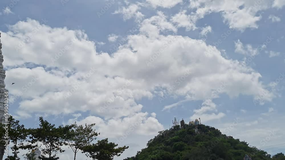 Panoramic view of the temple gopuram and Lord Shiva statue on the mountain Panoramic view of the temple gopuram and Lord Shiva statue on the mountain