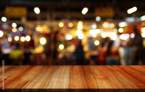 Empty wooden table with bokeh and blur restaurant background, for your photo montage or product display, Space for placing items on the table, product and food display.	