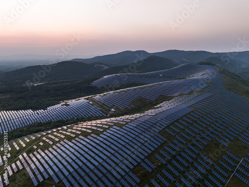 aerial view of solar power plant on hill