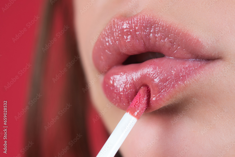 Naklejka premium Lipstick. Make-up for lips. Lipstick and pomade. Close up red lips. Pink lipstick. Pomade. Applying lipstick.