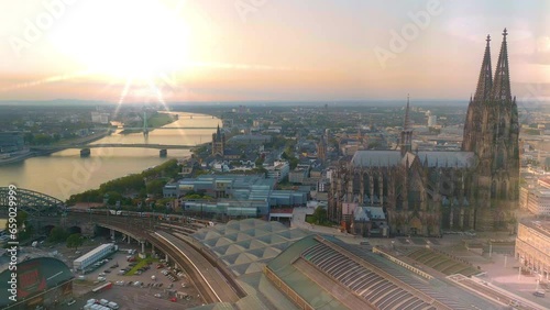 Cologne city skylineaerial view drone footage of cologne germany city view at sunrise in front colognecathedral dome brdige and river. photo