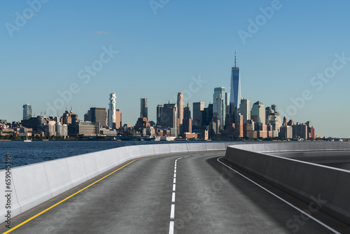 Empty urban asphalt road exterior with city buildings background. New modern highway concrete construction. Concept of way to success. Transportation logistic industry fast delivery. New York. USA.