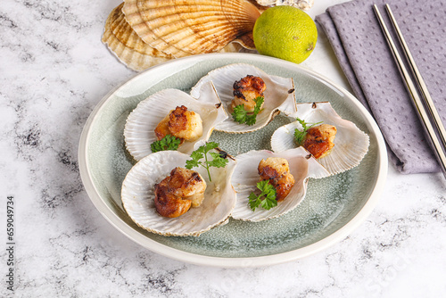 Grilled scallops shell with butter