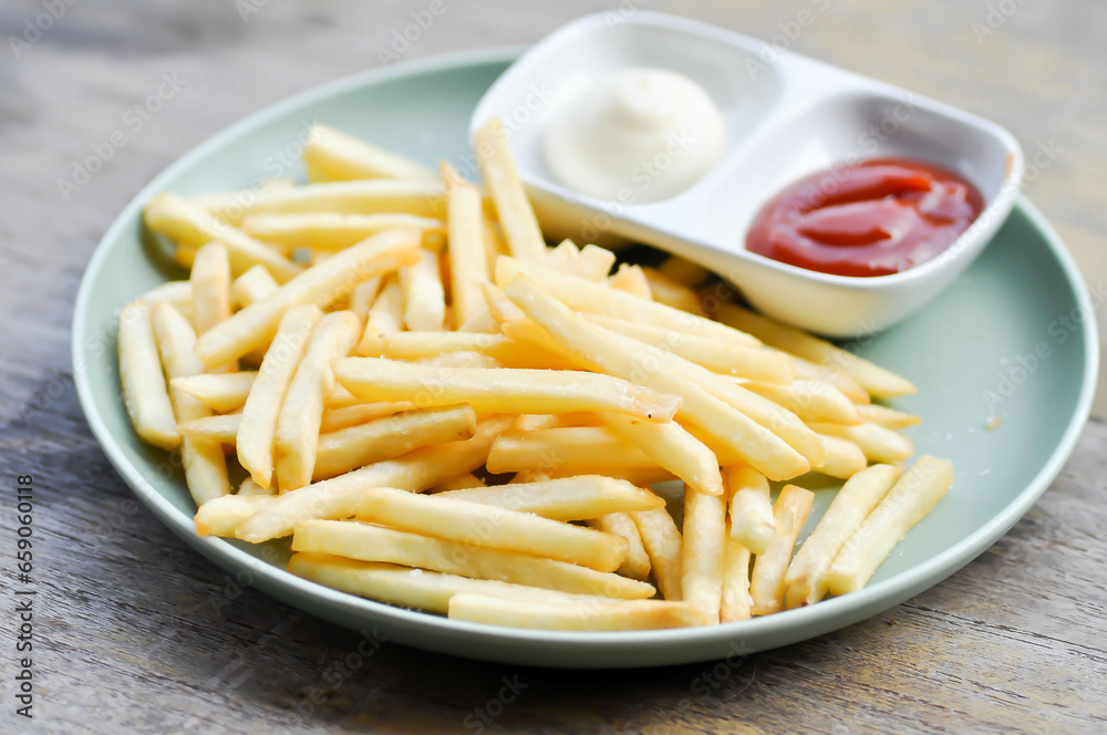 French fries or fried potato , fries with dip or tomato sauce French fries or fried potato , fries with dip or tomato sauce