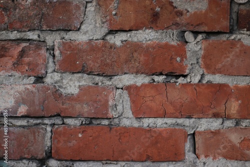 A fragment of careless brickwork made of red brick is depicted.