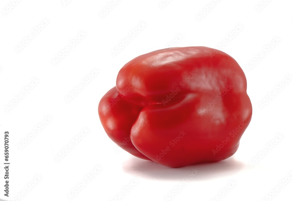 The fruit of red sweet bell pepper on a white background. The fruit of red sweet bell pepper on a white background.