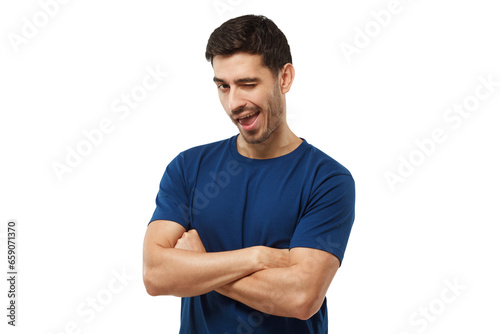 Handsome man with crossed arms smiling and winking at camera