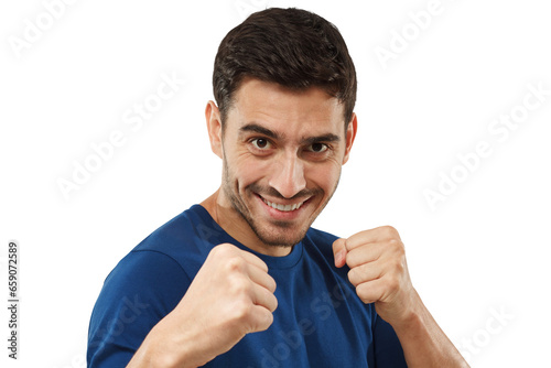Confident man in casual blue t-shirt holding fists in front of him, ready to fight and defend himself