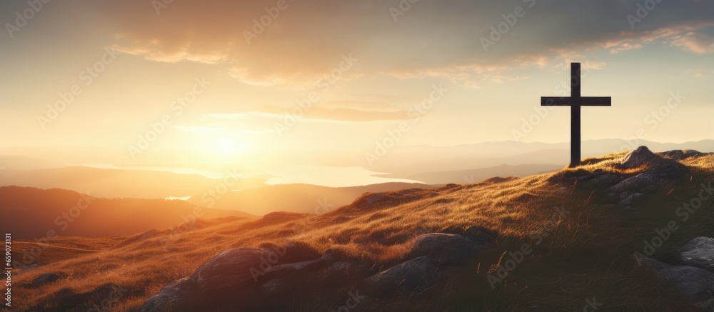Naklejka premium Jesus rising from the dead depicted by cross on a hill at sunrise