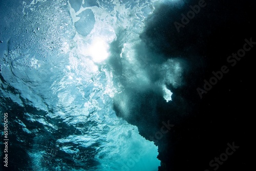 Looking at the sun underwater. Diving in the tunel of doom in Curaçao. Amazing dive site with lots of surprises. photo