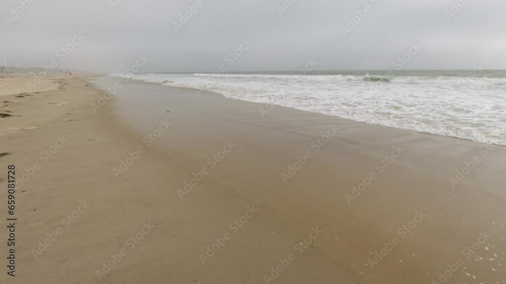 Sandy beach and ocean with waves. A beautiful white sand beach with clear blue water. Sandy beach and ocean with waves. A beautiful white sand beach with clear blue water.