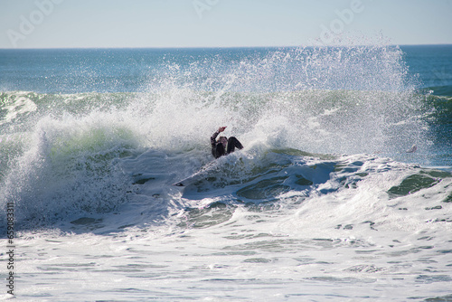 Surfer in a barrel falling under the force of the waves © Image'in