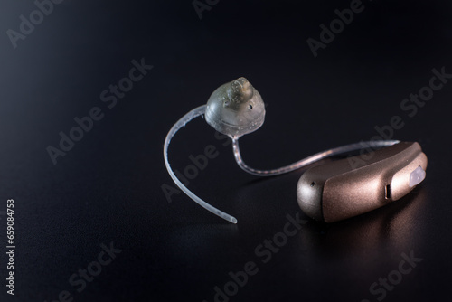 hearing aid lie on a black background