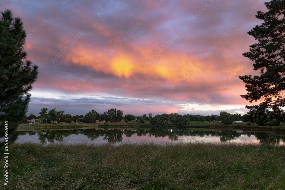 Greeley Colorado sunset over Centennial park.   - obrazy, fototapety, plakaty 
