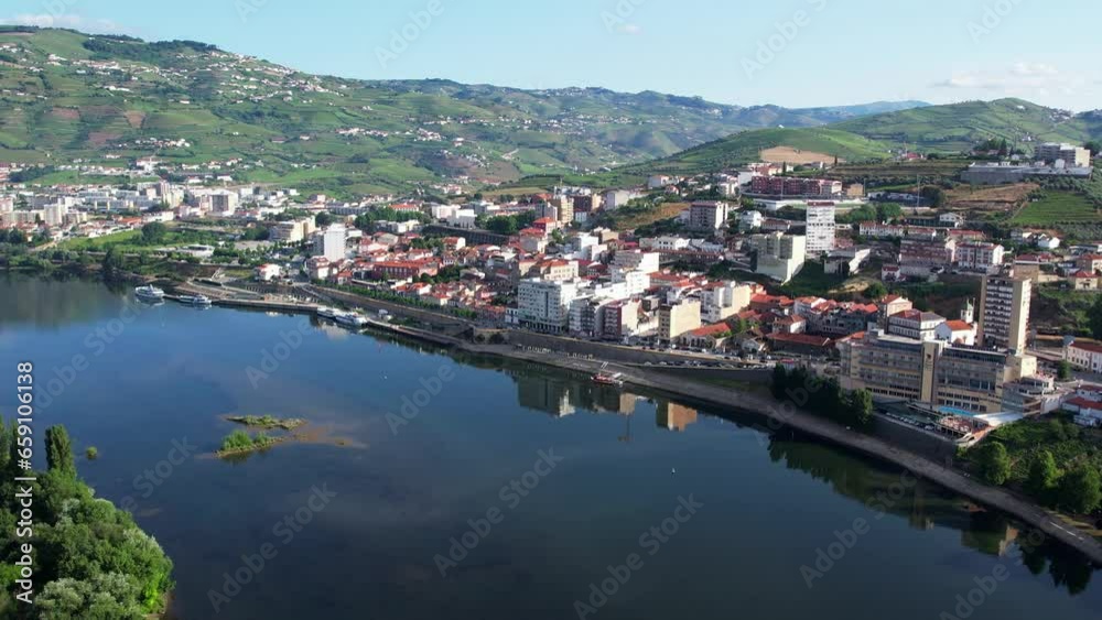 Aerial Flyover above Peso da Régua on the Douro River in the Douro Valley Portugal Aerial Flyover above Peso da Régua on the Douro River in the Douro Valley Portugal