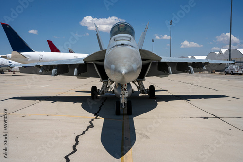 F-18 Hornet fighter jet parked at an airfield.