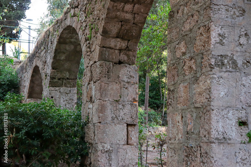 Aqueduct, a watercourse arch over the Rodini Park lake and walking path located in central Rhodes