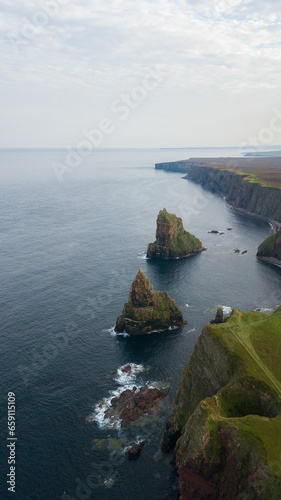 Beautiful rock stacks and stunning landscape of Scotland. Duncansby head are lying near John o Groats and it is a northern east of United Kingdom. This place is home for seals and thousands of seagull photo