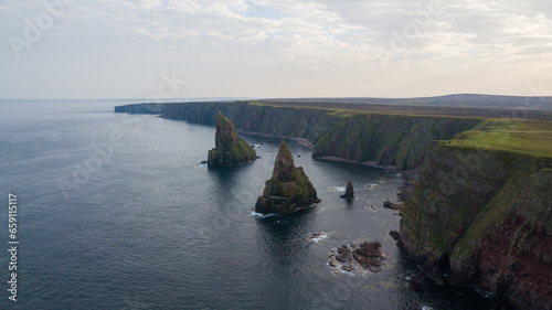 Beautiful rock stacks and stunning landscape of Scotland. Duncansby head are lying near John o Groats and it is a northern east of United Kingdom. This place is home for seals and thousands of seagull photo