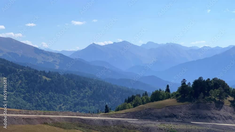 View of the mountain range near Mount Zakan. The top of the mountain node of the western part of the main ridge of the Greater Caucasus. Zakan Peak is the beginning of the Magisho mountain range. 4К View of the mountain range near Mount Zakan. The top of the mountain node of the western part of the main ridge of the Greater Caucasus. Zakan Peak is the beginning of the Magisho mountain range. 4К